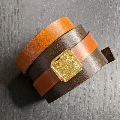 LEATHER BRACELET WITH GOLDEN DRAGON AMULET | < Z-FIRE.COM > .999 Fine Silver Amulet Removable 24K Gold Plated 1.5" Brown leather bracelet, with a 0.6" tan wrap-around leather strap About 1.5 Inches Total Length About 14 cm Total Length﻿ Free Astrology Report of Choice Free Standard Shipping Hassle Free Returns