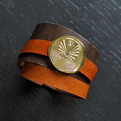.999 Fine Silver Amulet/ Removable 24K Gold Plated  1.5" Sundance leather bracelet, with a 0.6" Tan wrap-around leather strap,  Leather rivets and button clasps are of base metals Free Zodiac Report Free standard shipping Hassle Free Returns