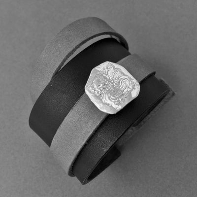LEATHER BRACELET WITH REMOVABLE DRAGON AMULET | < Z-FIRE.COM > .999 Fine Silver Amulet/Charm 1.5" Black leather bracelet 0.6" mahogany, grey or tan wrap-around leather strap Free Astrology Report Free standard shipping hassle Free Returns